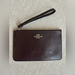 Coach wristlet like new condition plum